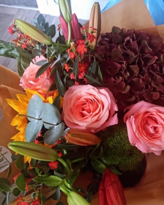 Autumn wrap of flowers in brown paper