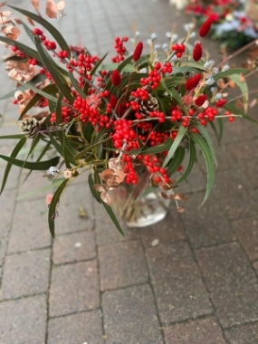 Christmas vases filled with Christmas Folliage and berries